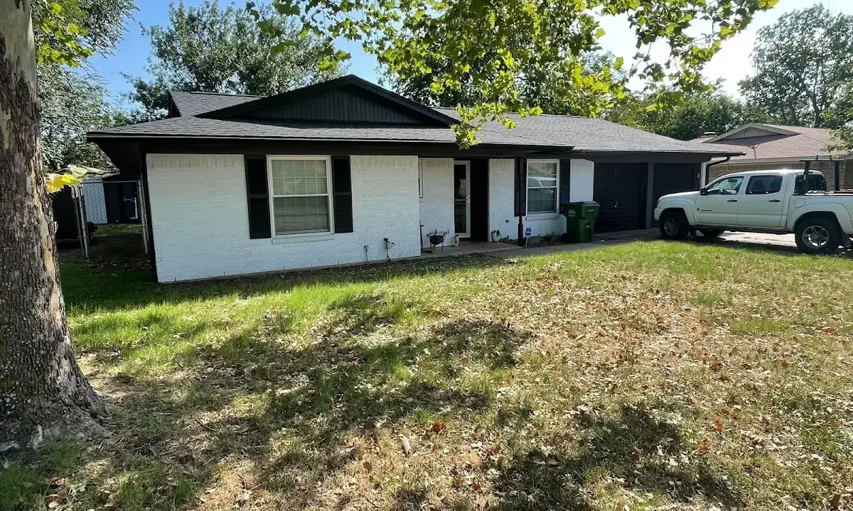 Professional roofing crew working on a residential roof in Maxatawny